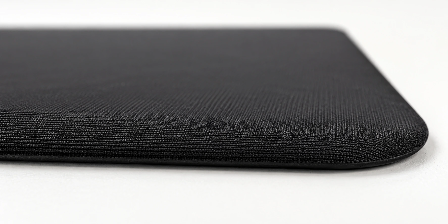 Low-angle construction detail showing the thin cloth surface and dark base